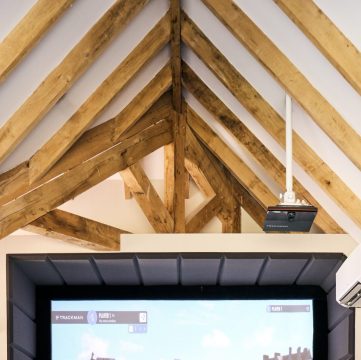 Golf Simulator Room with Oak Trusses